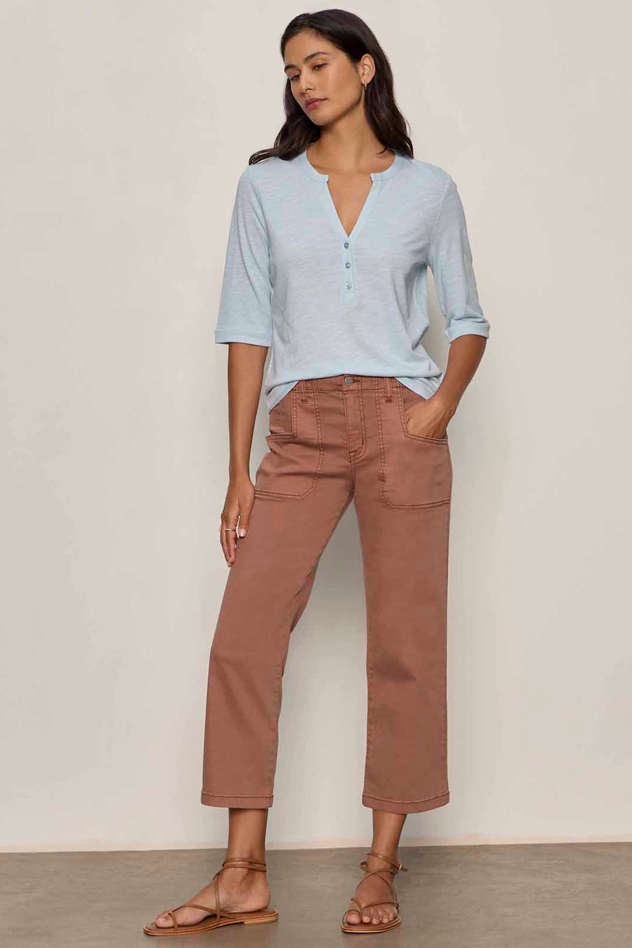 front view of baby blue 3 button v neck with rolled sleeves