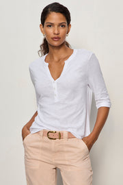 white 3 button v neck top with rolled sleeves