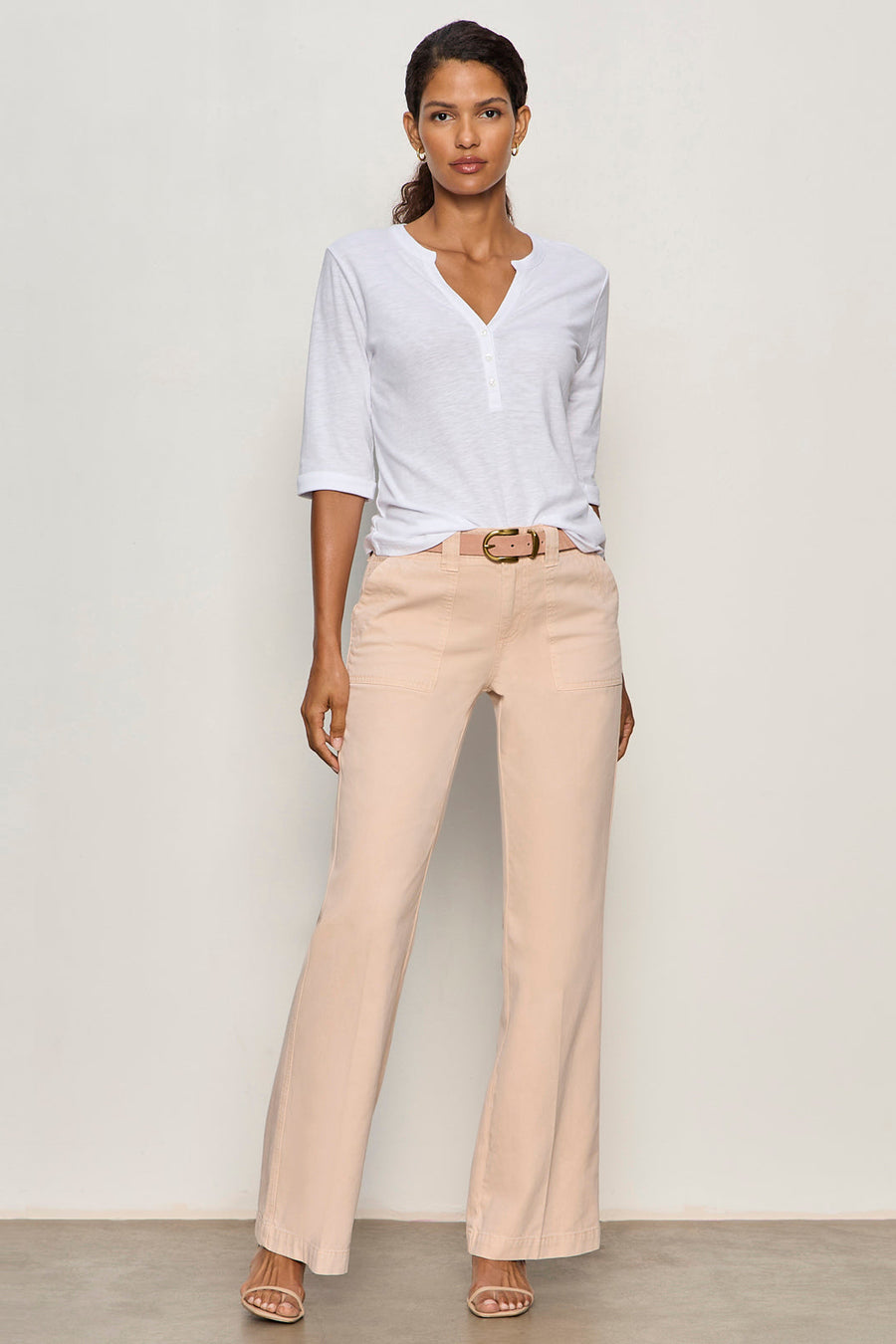 front view of white 3 button v neck top with rolled sleeves