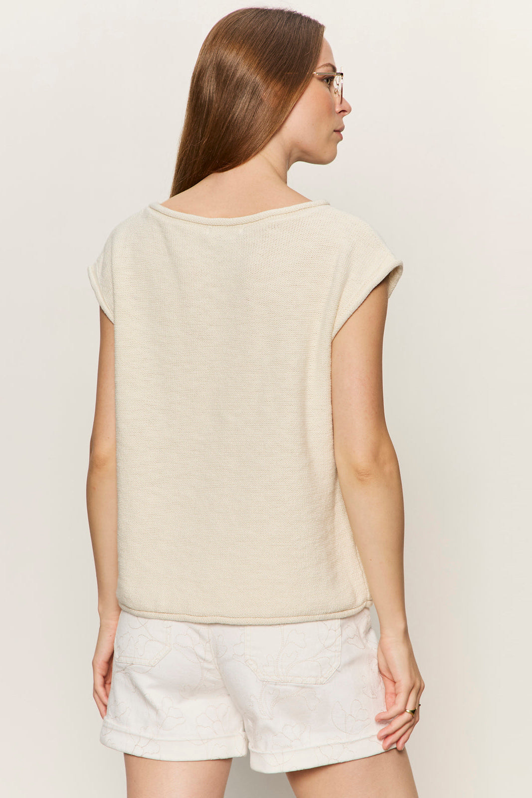 back view of cap sleeve tee shirt with a front pocket