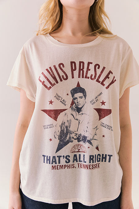 Person wearing a t-shirt with Elvis Presley graphic and text.