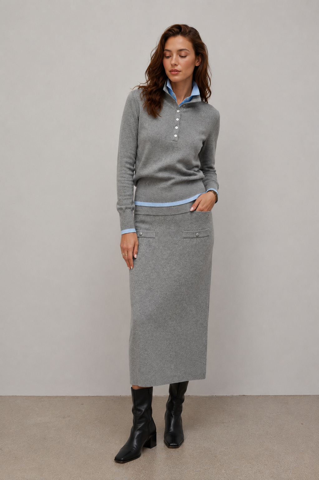 woman wearing grey knit midi skirt with front pocket detail