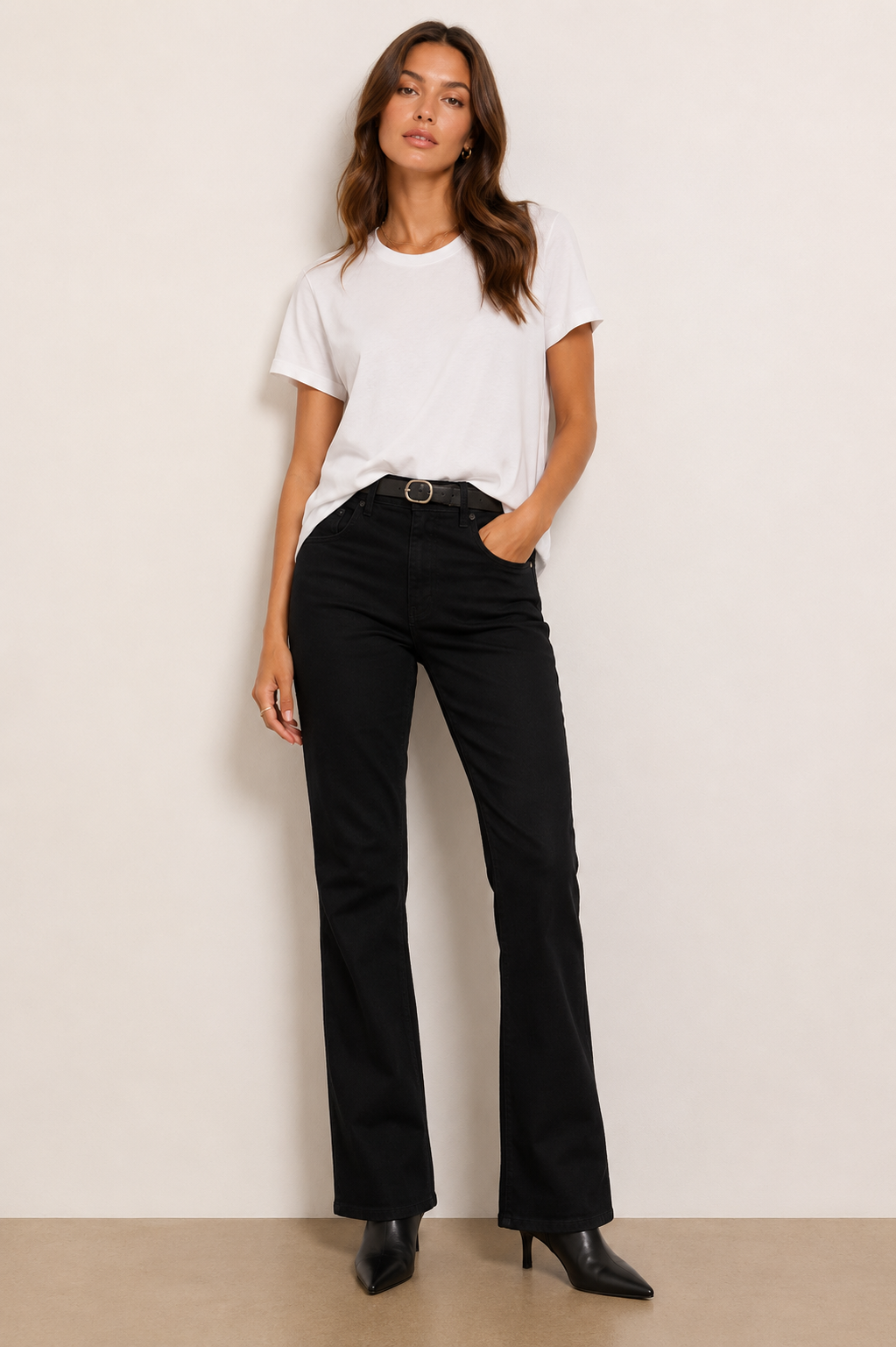 Woman wearing black boot cut pants. 
