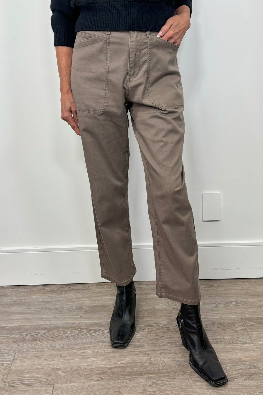 Front view of woman wearing a pale brown pant