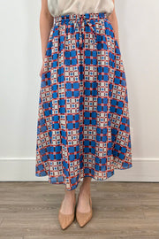 woman wearing an azulejos patterned midi skirt 