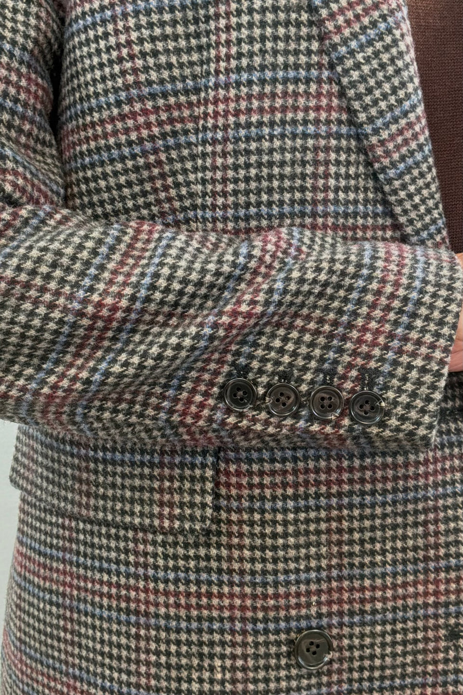 Woman wearing a checkered blazer