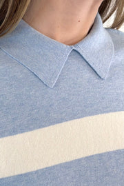 Close-up a blue and white striped polo sweater