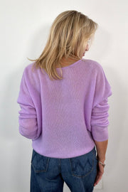 woman wearing a cashmere lilac oversized reversible sweater