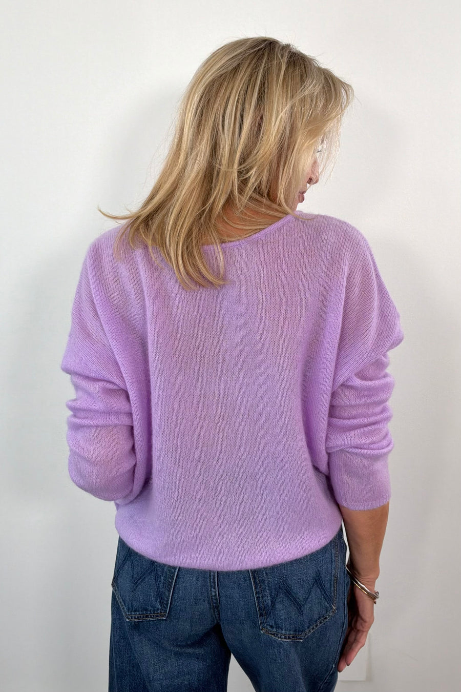 woman wearing a cashmere lilac oversized reversible sweater