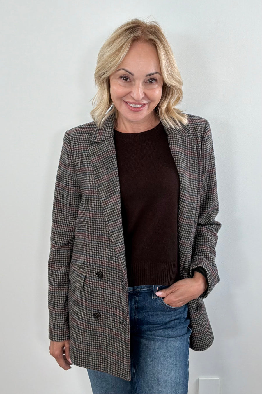 Woman wearing a checkered blazer