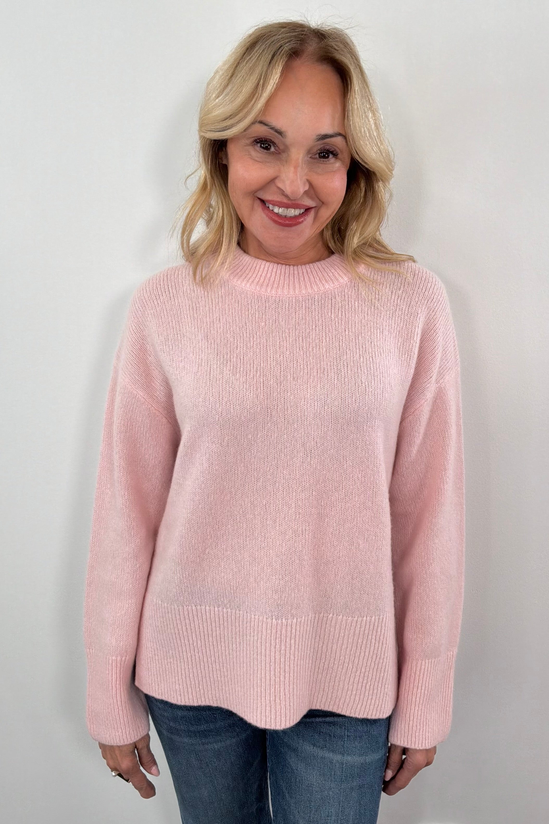 Woman wearing a pink sweater