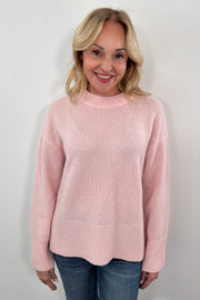 Woman wearing a pink sweater