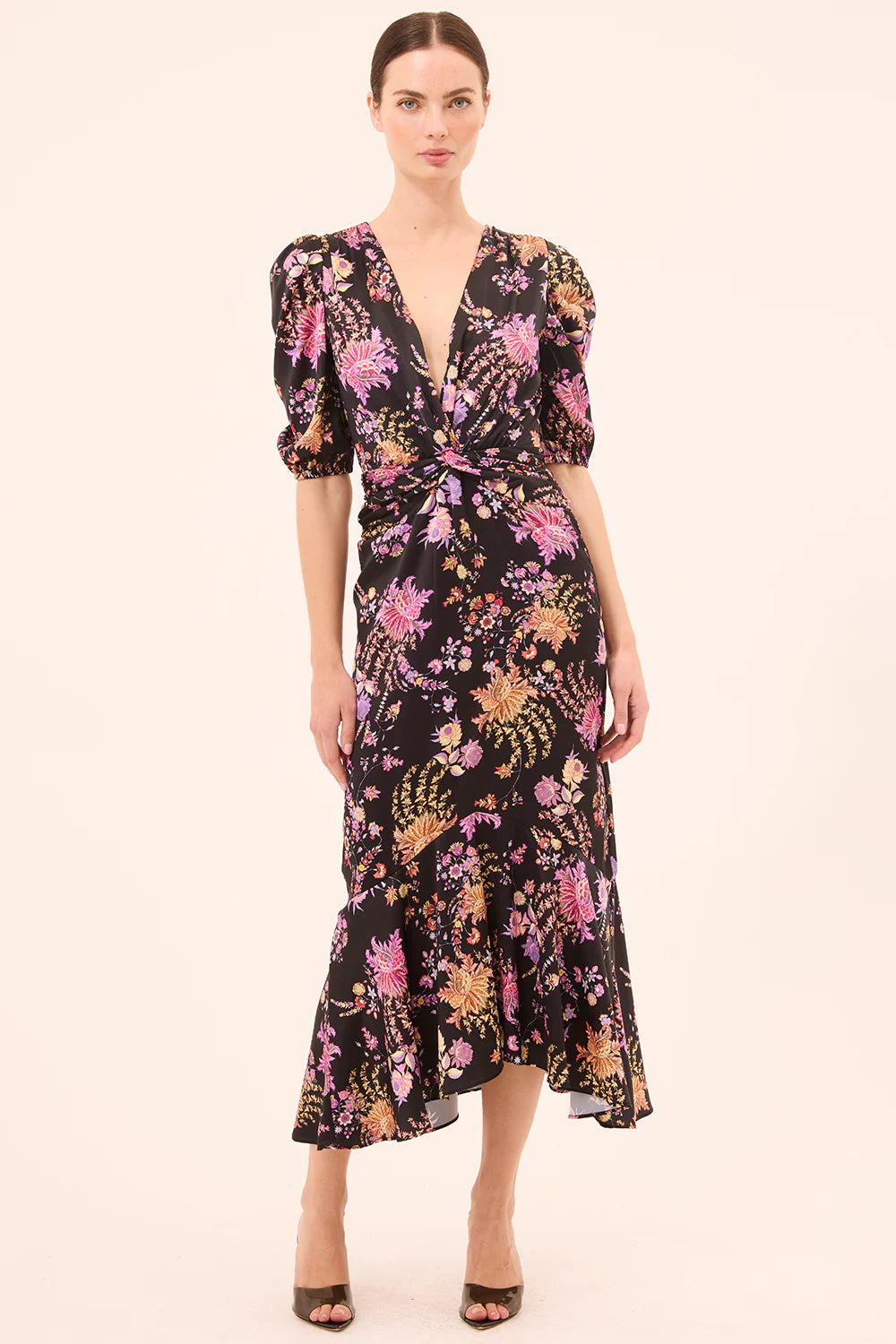 Woman wearing a floral dress on a white background