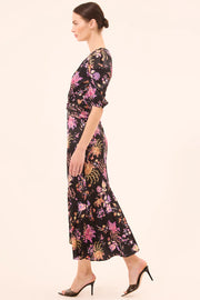 Woman wearing a floral dress on a white background