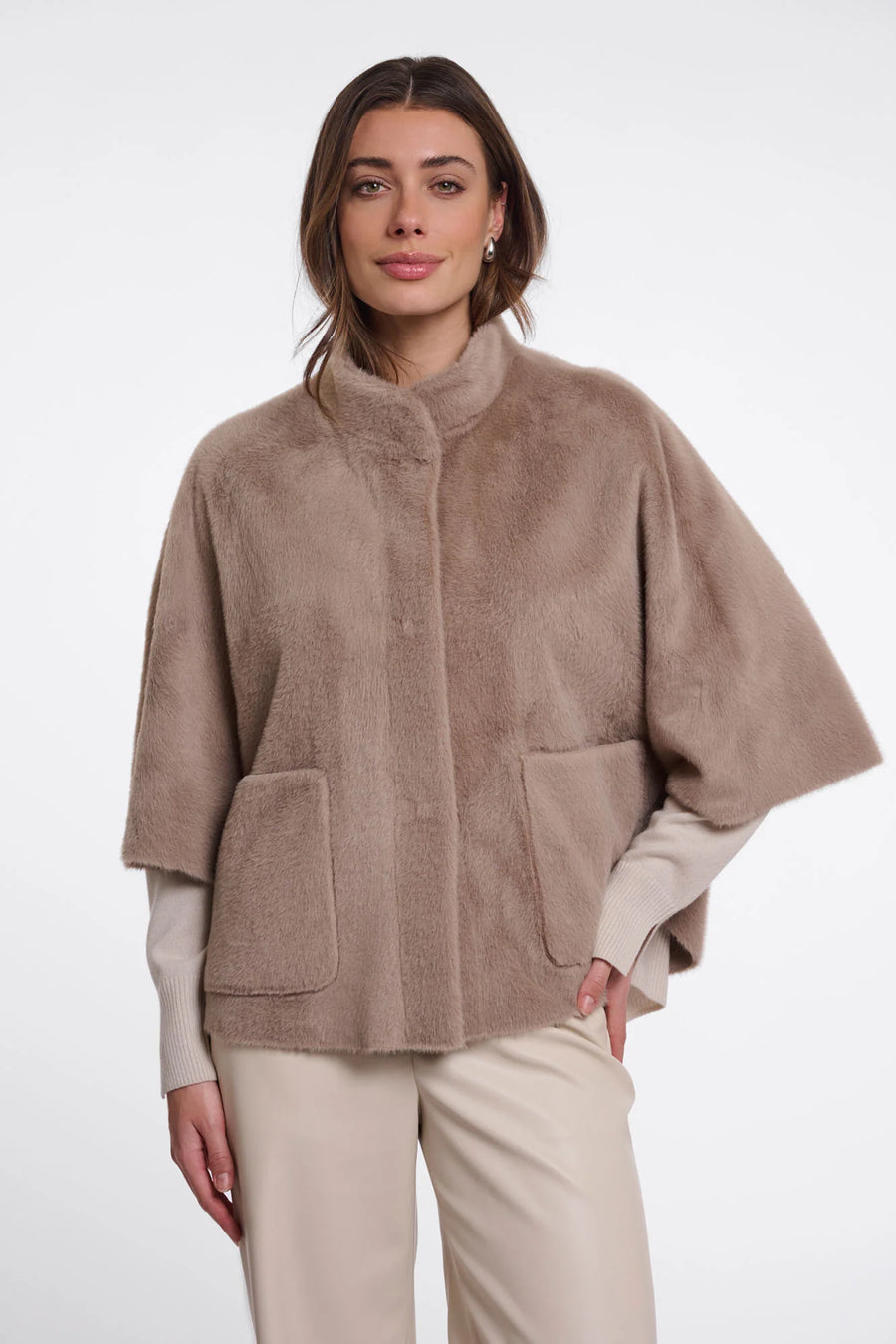 woman wearing brown fur high neck cape