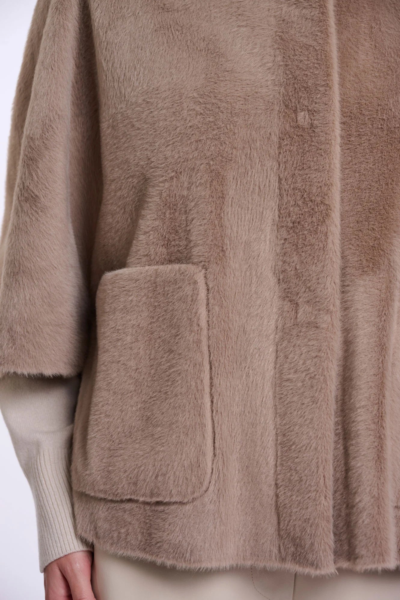woman wearing brown fur high neck cape