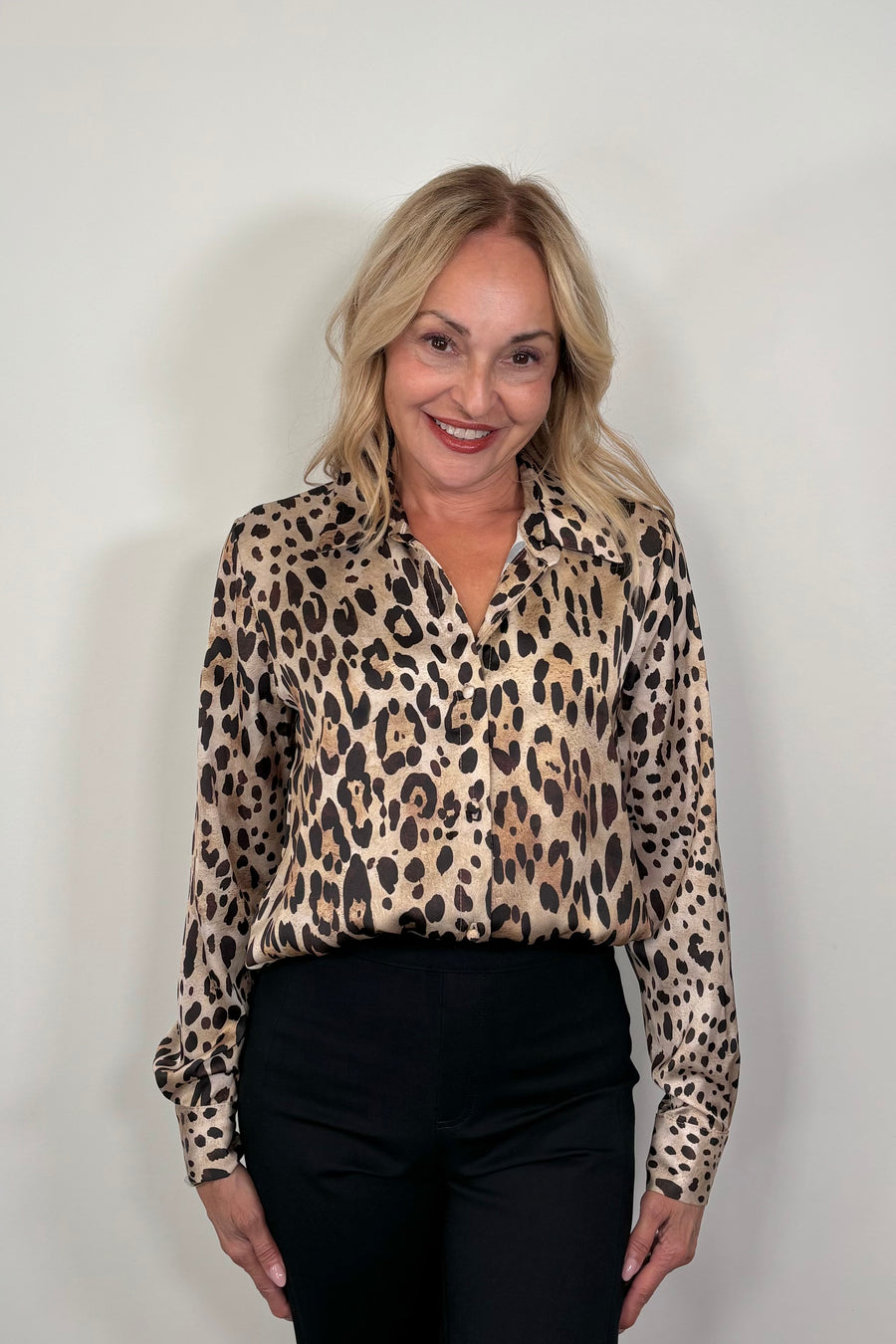 woman wearing a leopard print button down shirt