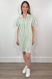 Woman wearing a light green and white striped shirt dress with a collar