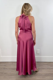 Woman wearing a pink sleeveless satin dress