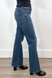 woman wearing straight leg boot cut blue jeans