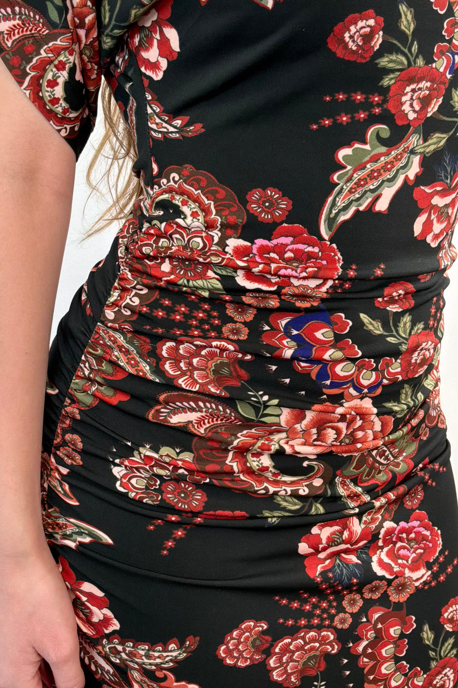 Close-up of a maxi rouched floral dress 