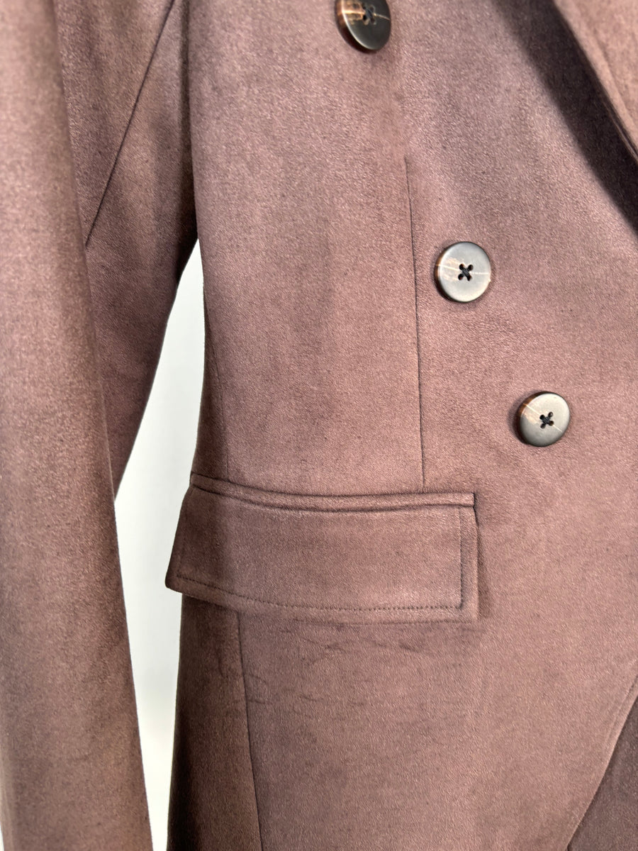 Close-up of a brown coat with buttons and a pocket on a white background
