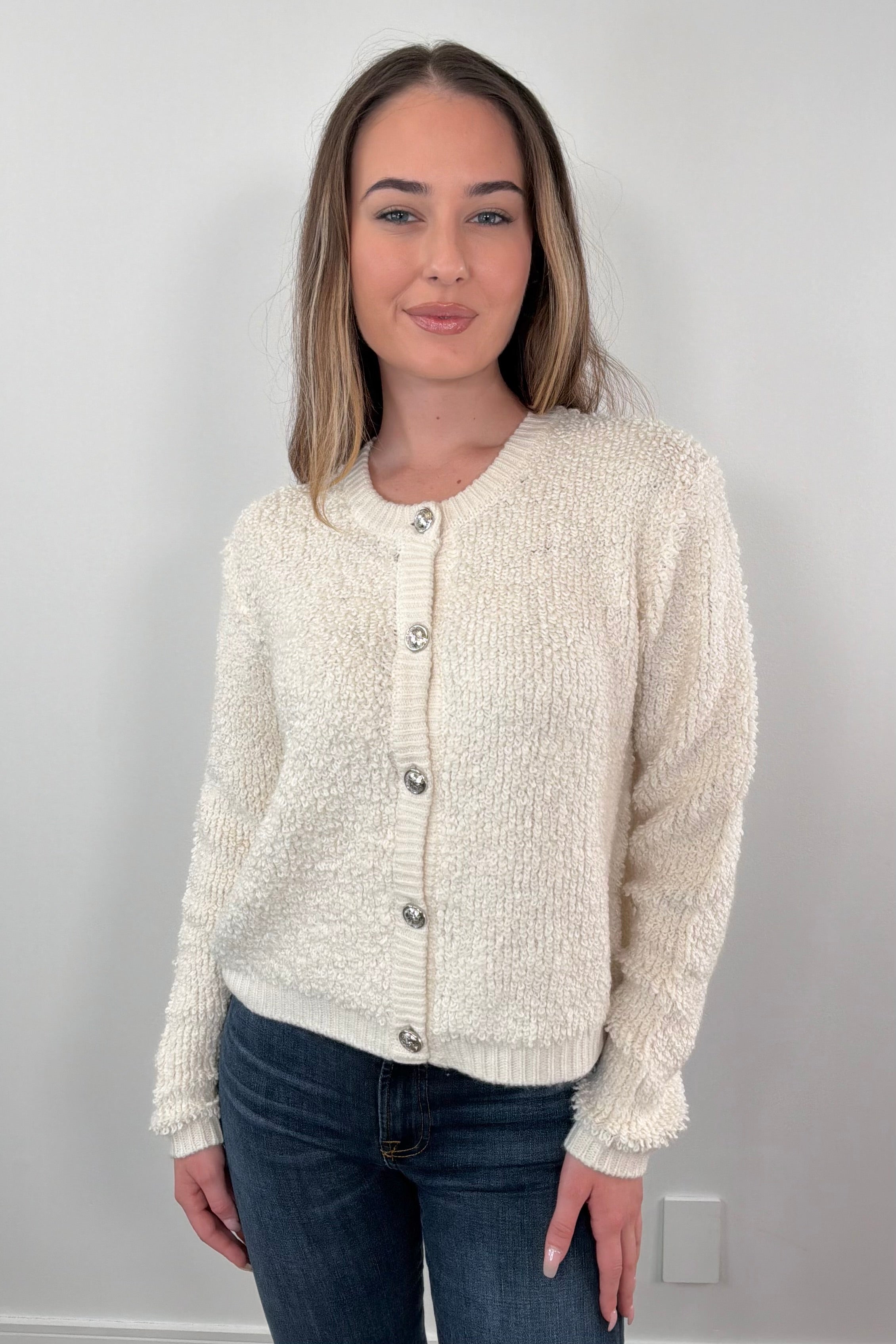 Woman wearing a cream cardigan
