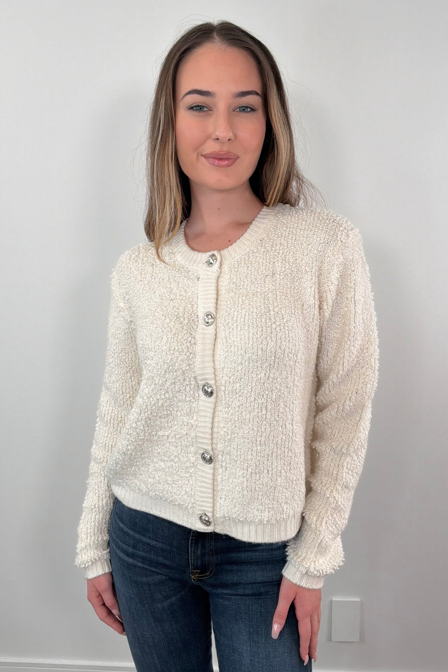 Woman wearing a cream cardigan