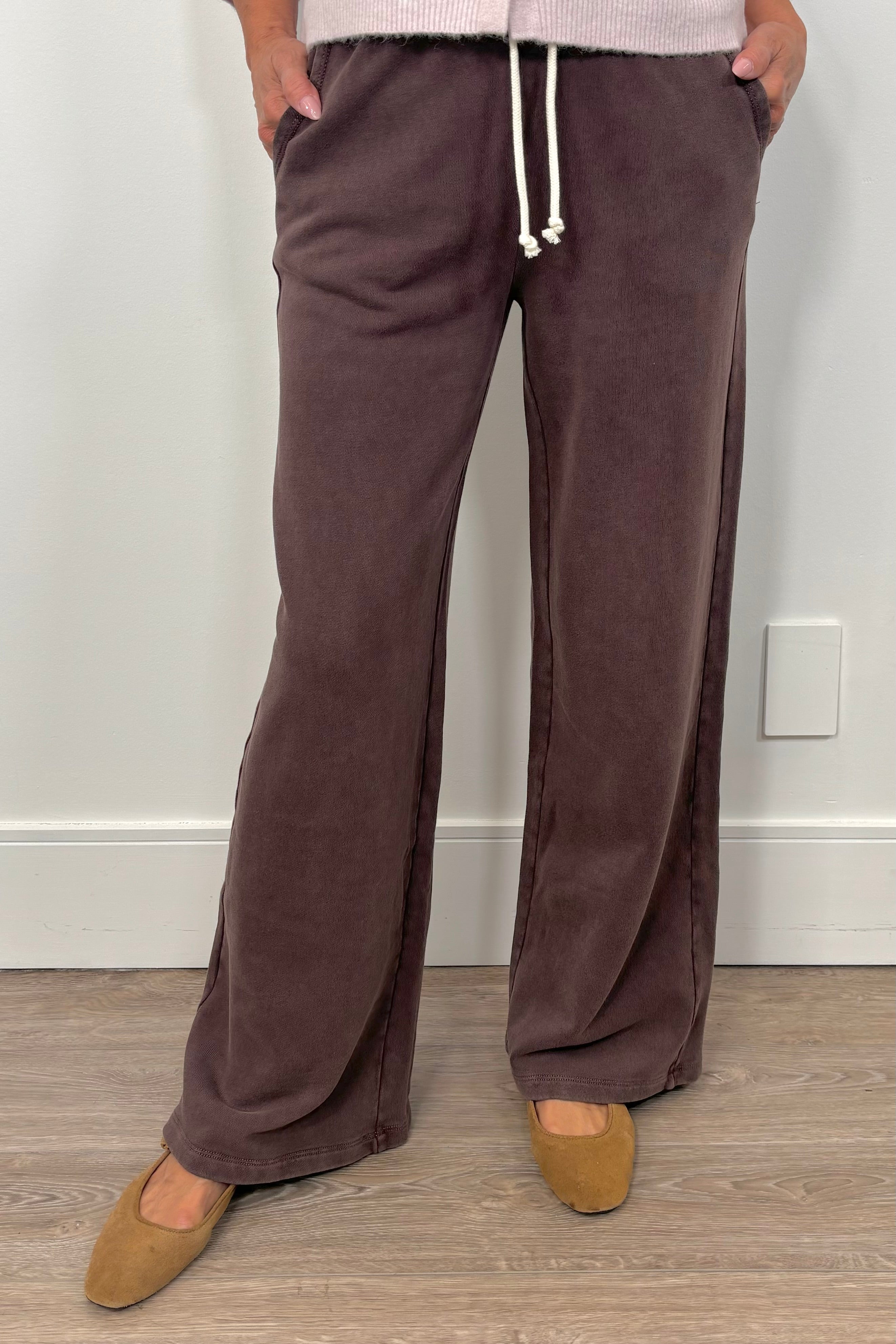 Person wearing brown wide-leg brown knit pants