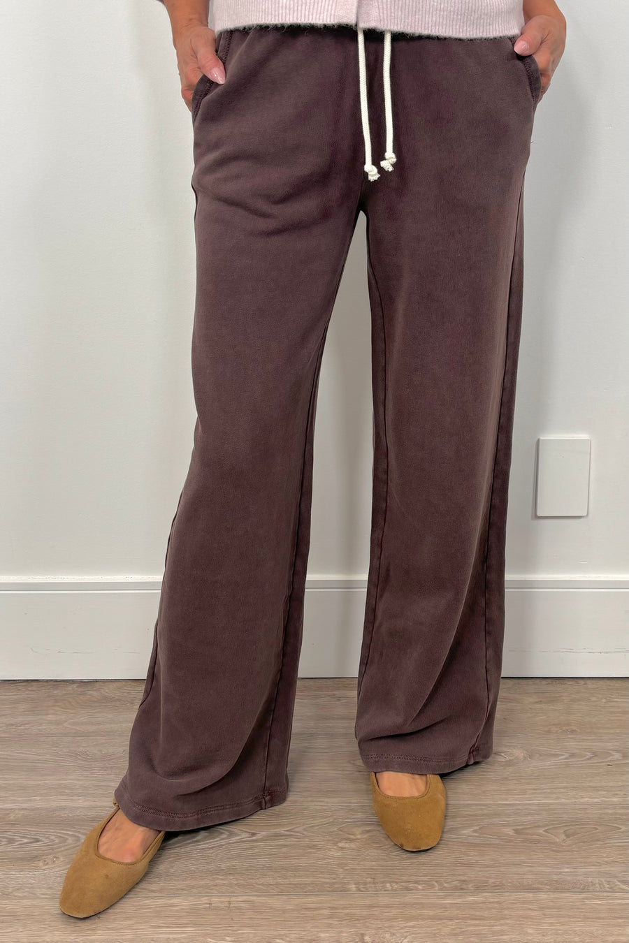 Person wearing brown wide-leg brown knit pants