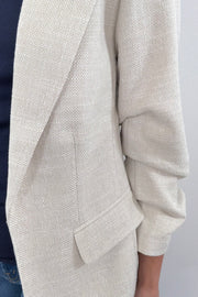 Close up of sand Open blazer with rouched sleeves