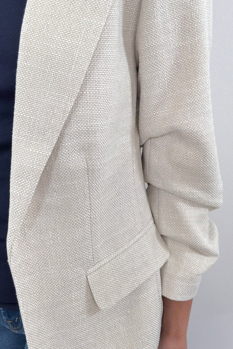 Close up of sand Open blazer with rouched sleeves