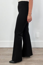 Person wearing black flared pants