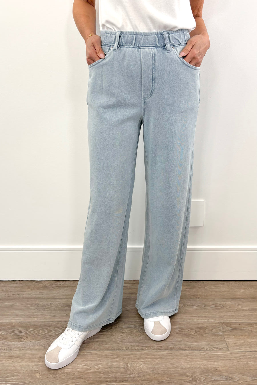 light blue wide leg denim pants with elastic waistband and front pockets