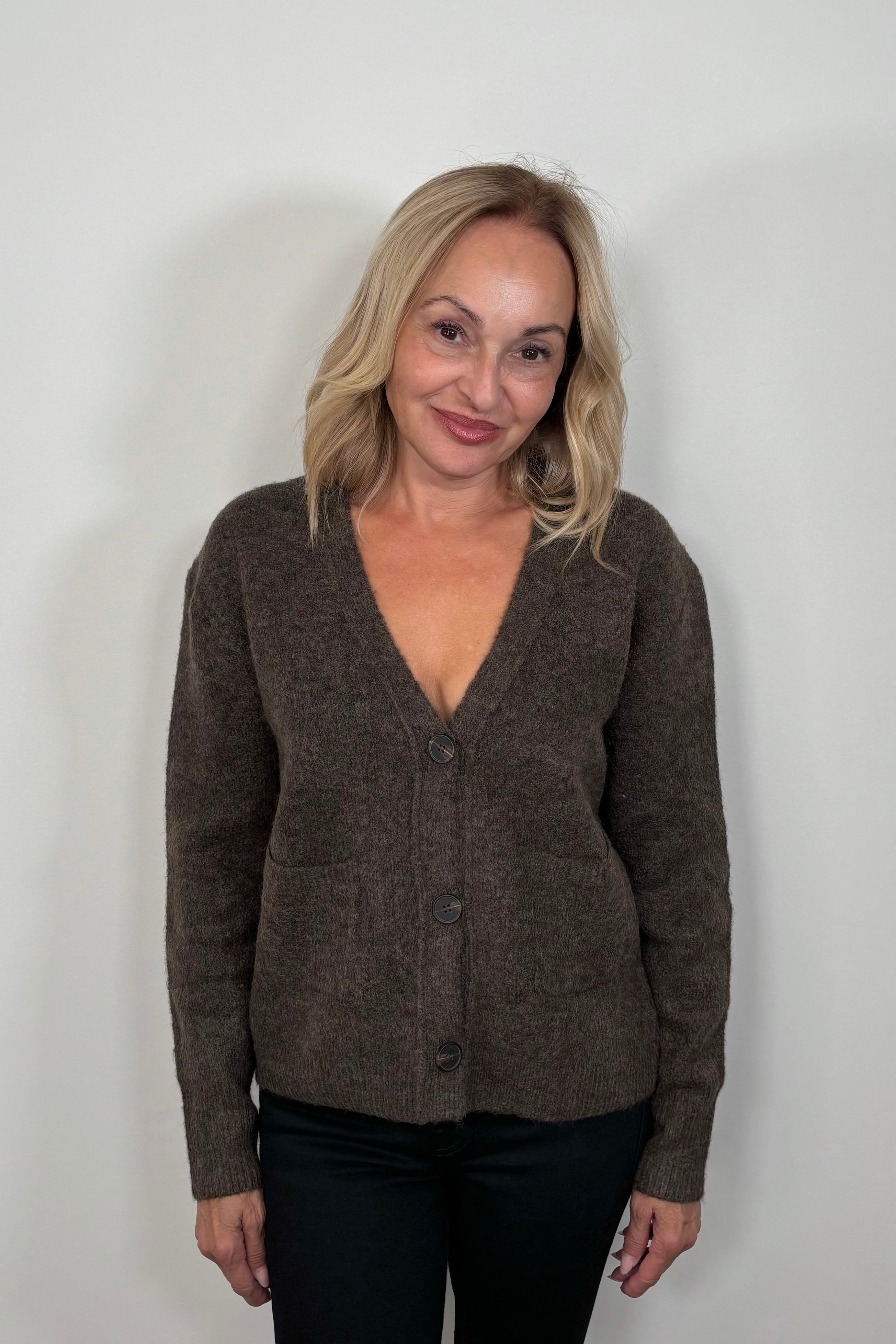 woman wearing Brown cardigan with front pockets 
