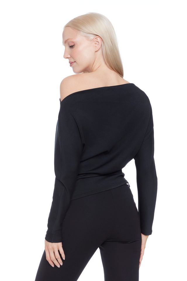 Side view of woman wearing a soft cowl neck rouched long sleeve top in Black