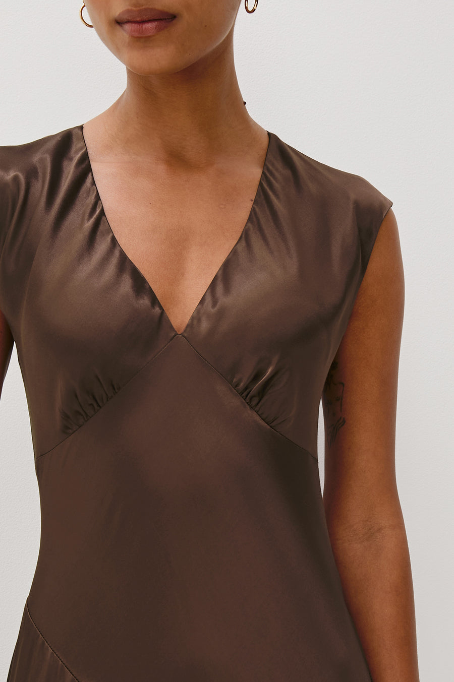 Close up of satin brown dress