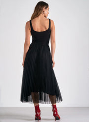 back of a woman waring black sleeveless dress with a tulle skirt