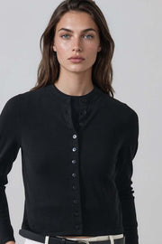 woman wearing fitted black button up cardigan