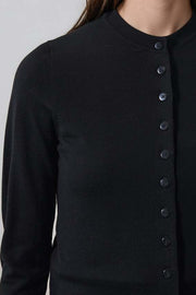 woman wearing fitted black button up cardigan