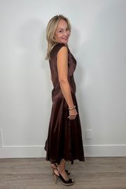 side view of woman wearing a chocolate brown satin dress