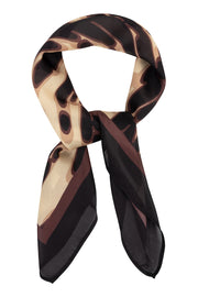 A lightweight silk scarf featuring an abstract wavy pattern in beige, brown, and black, styled in a loop