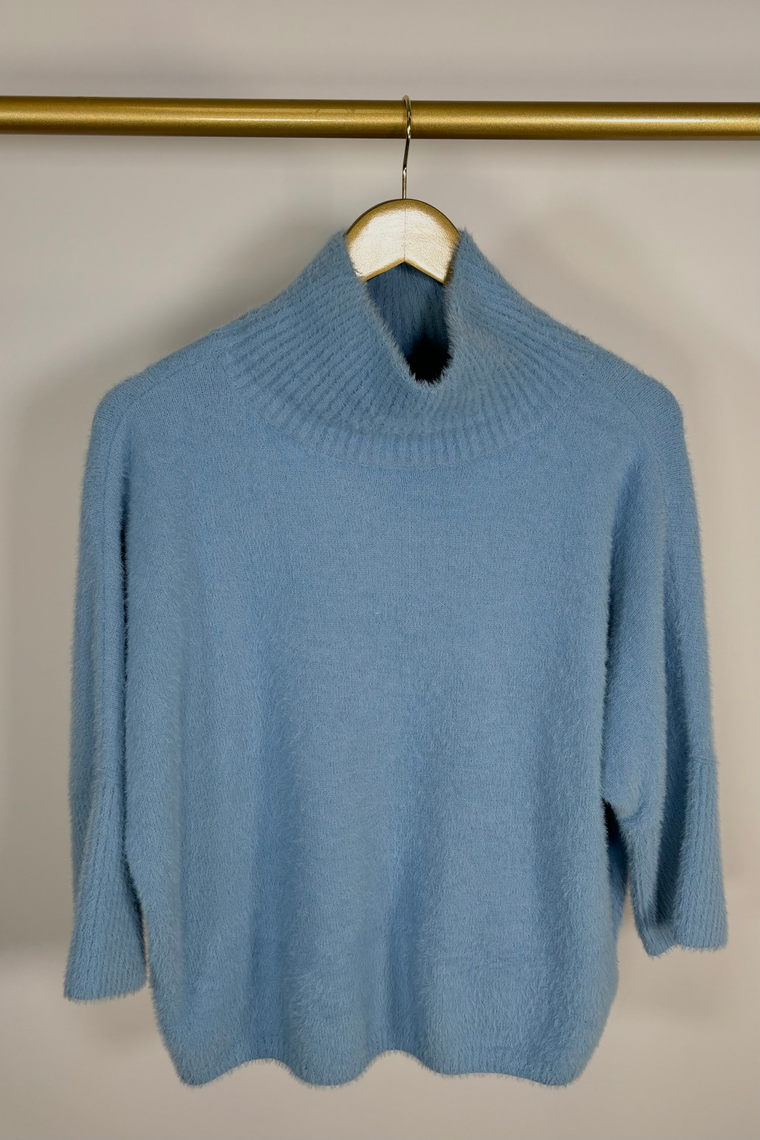 Front view of baby blue mock neck hairy sweater