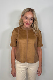 Woman wearing a suede leather and crochet top 