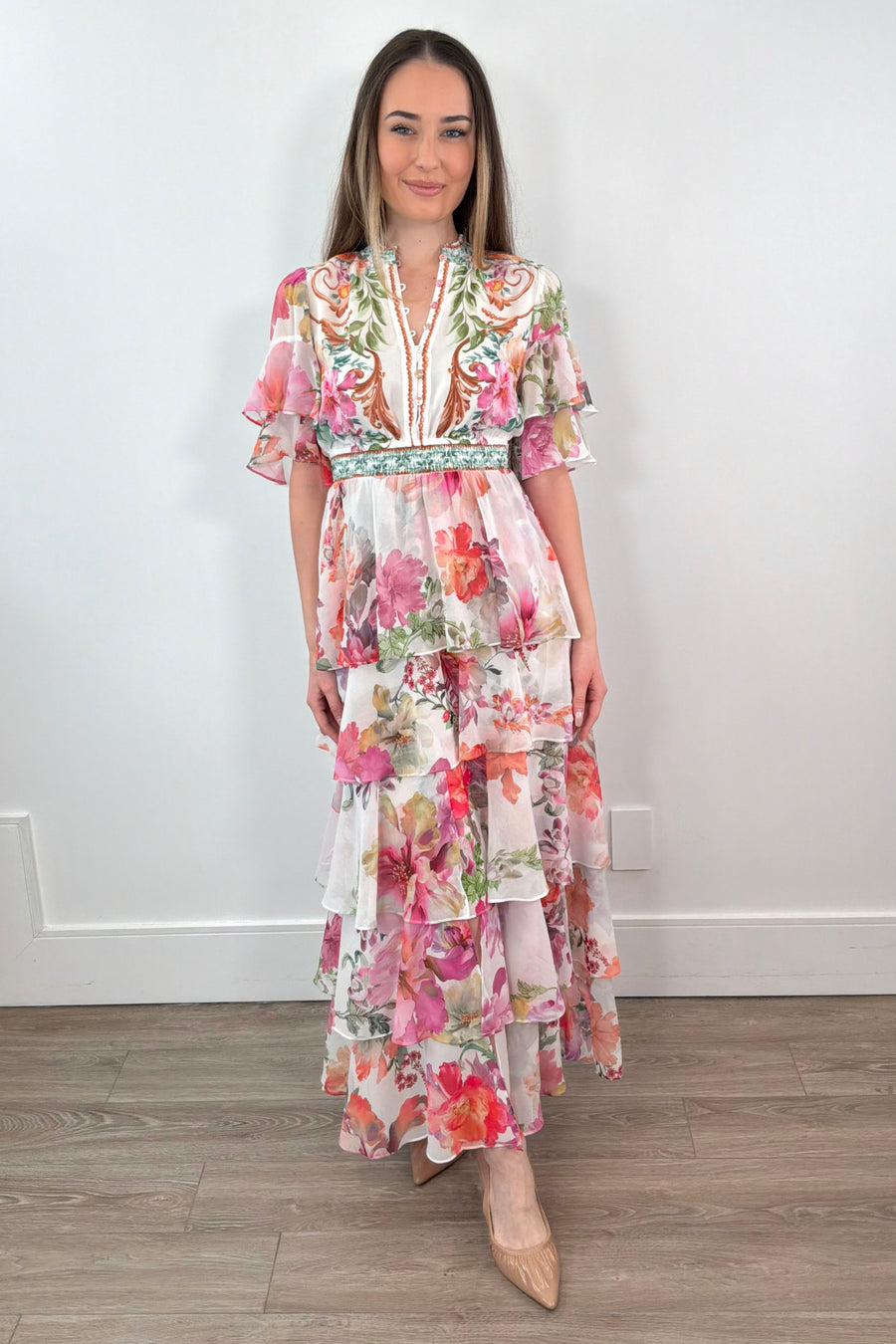 Woman wearing a floral tiered dress 