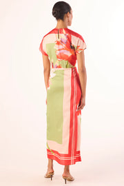 Woman wearing a boat neck short sleeve wrap waist scarf colorful floral dress