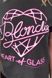 Close-up of a black t-shirt with pink graphic design