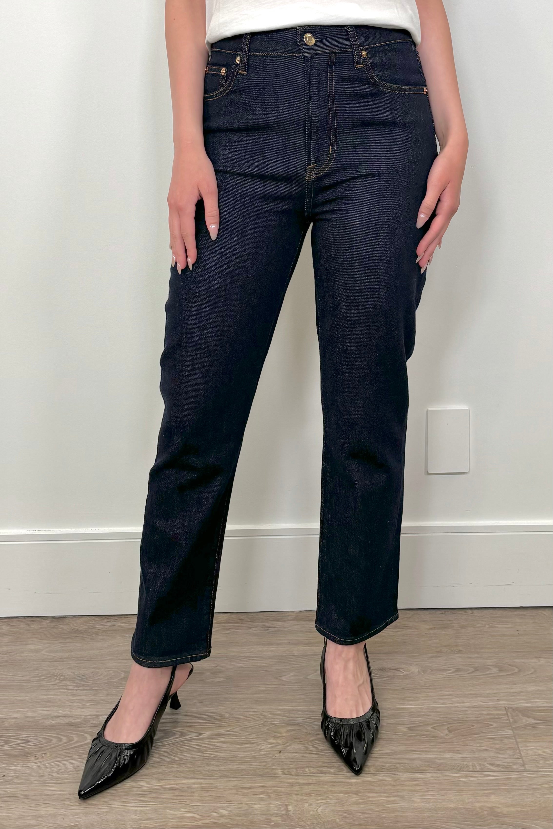 woman wearing dark wash straight keg crop jean