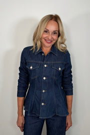 Front view of woman wearing a fitted denim jacket