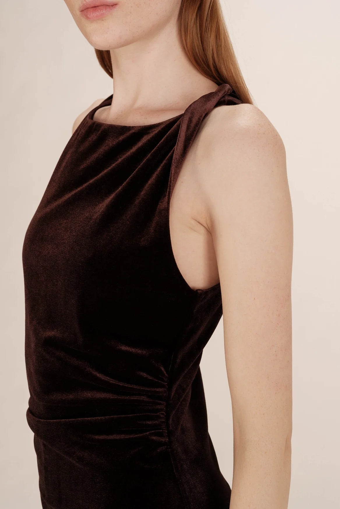 close-up of the shoulder of a brown velvet dress